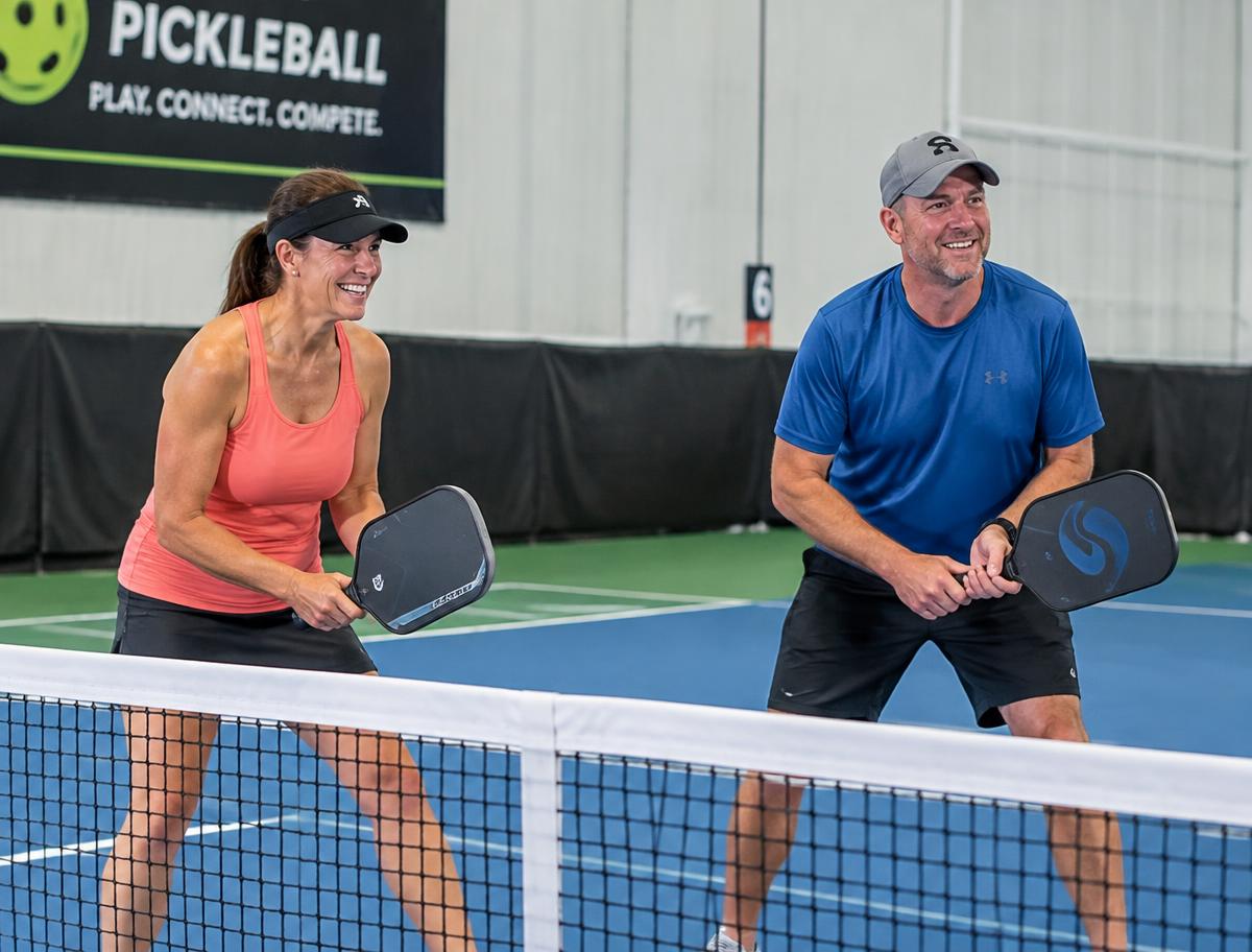 Friendly pickleball doubles at the net